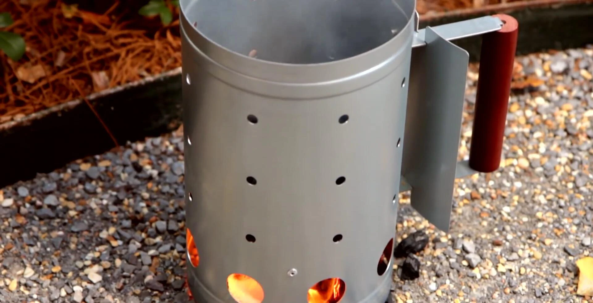 Lighting charcoal in the Blaze Kamado grill.