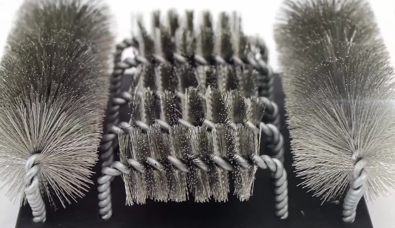 Detailed image of the Grillinator brush head, emphasizing the dual-bristle system.