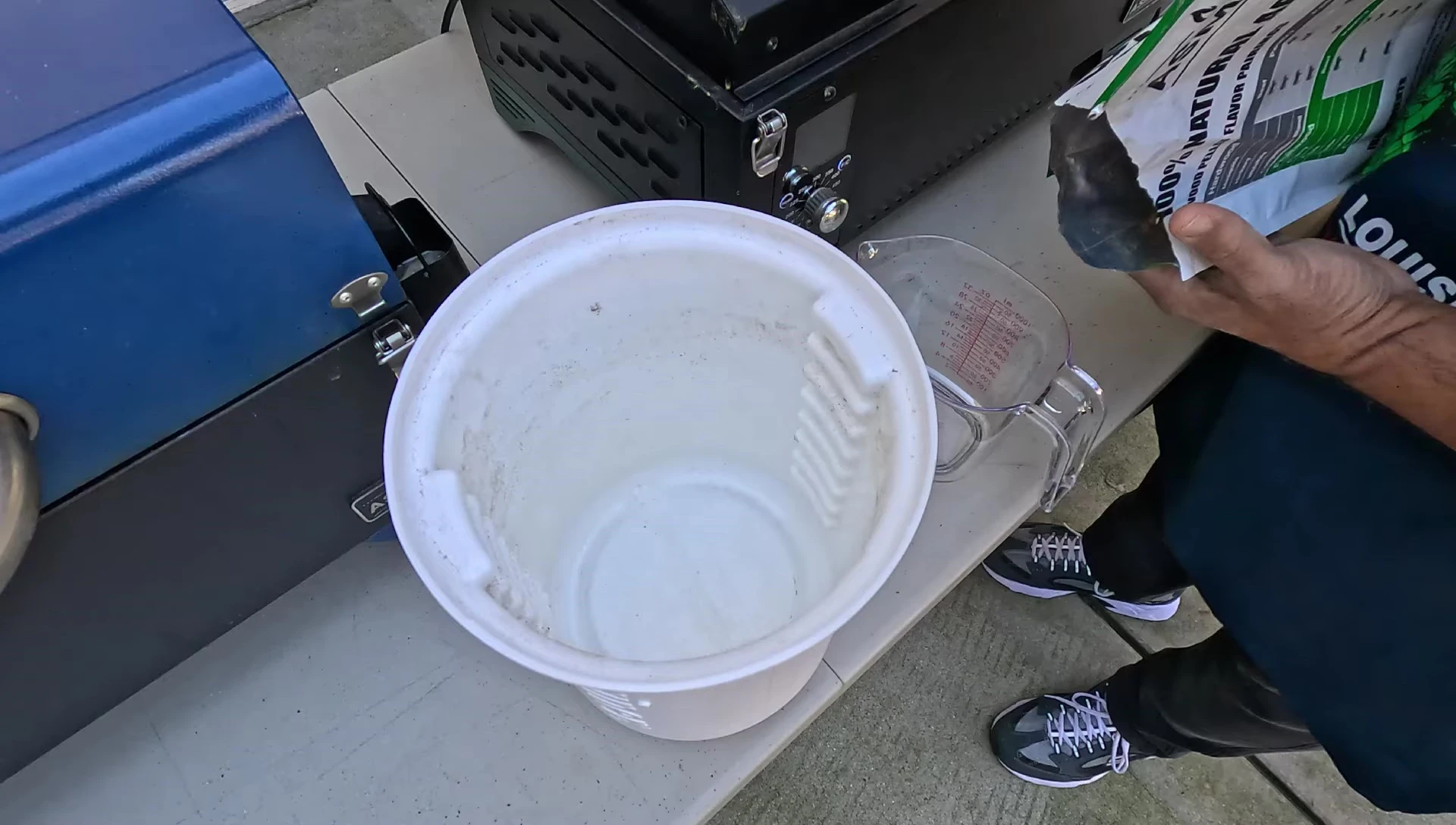 Measuring and combining apple pellets and Jack Daniel's chips.