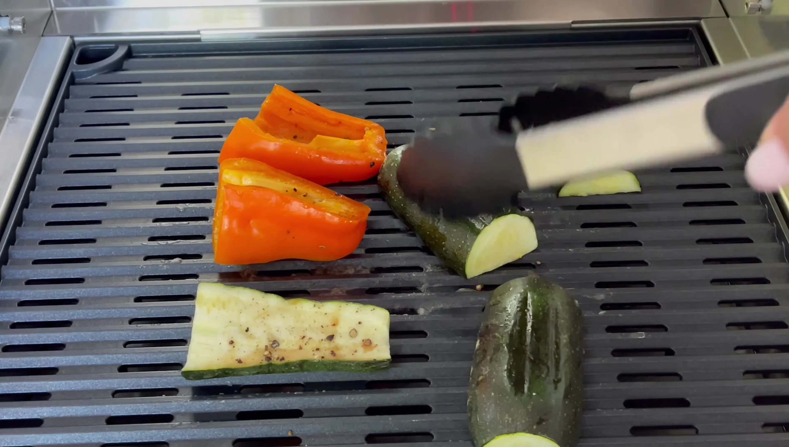 The vegetables are being flipped during the cooking process