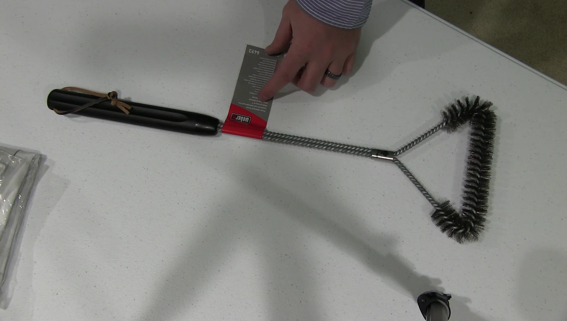 Final shot of the Weber grill brush, emphasizing the brand and model.