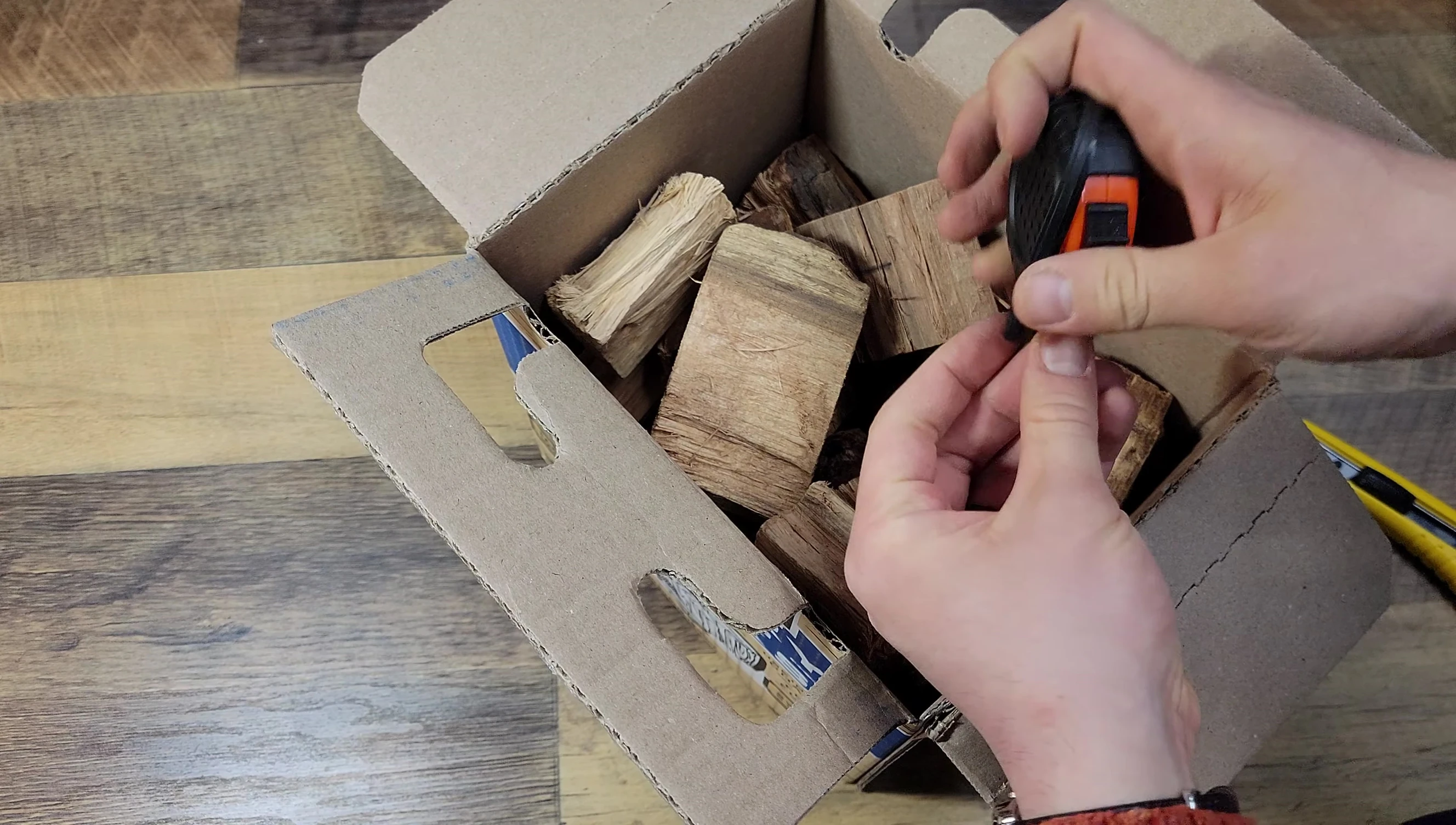 The reviewer holding a tape measure to check the empty space