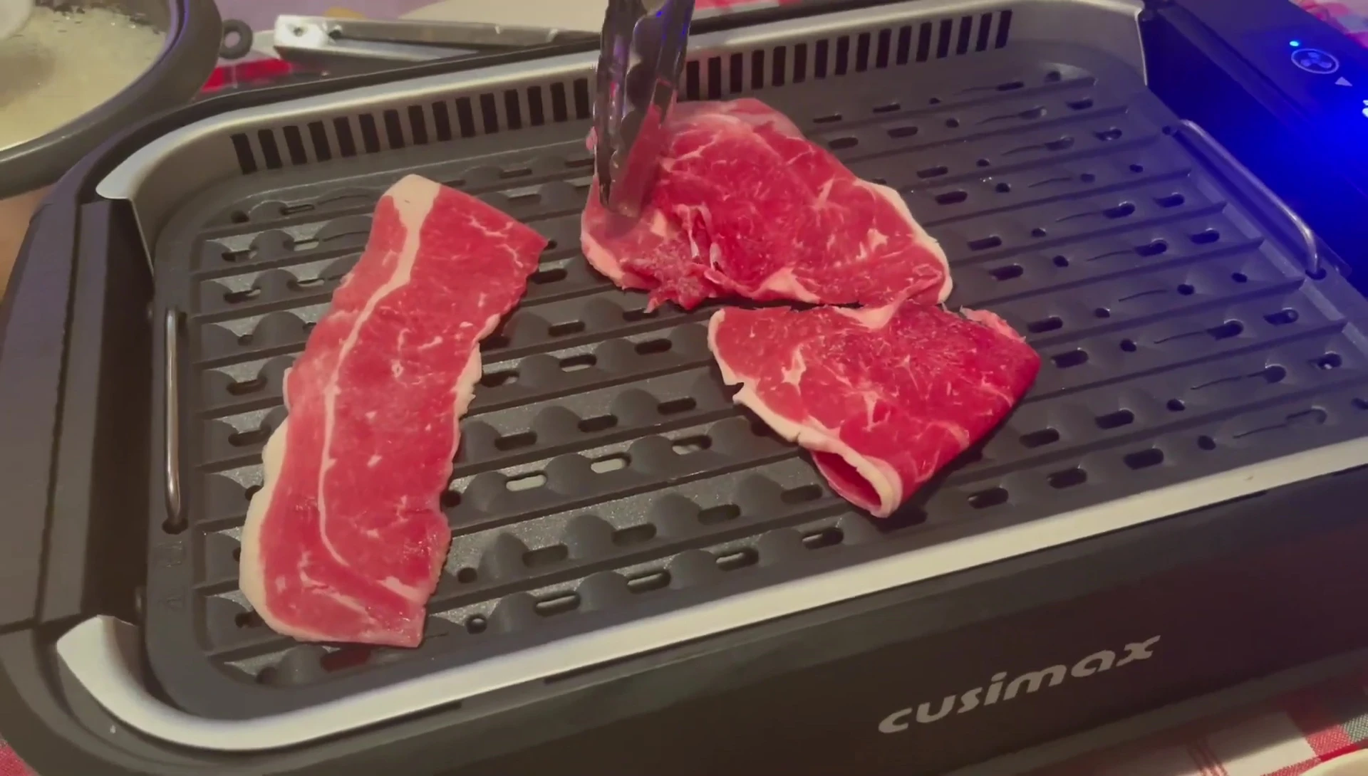 Demonstration of the smokeless technology in action; minimal smoke is visible.
