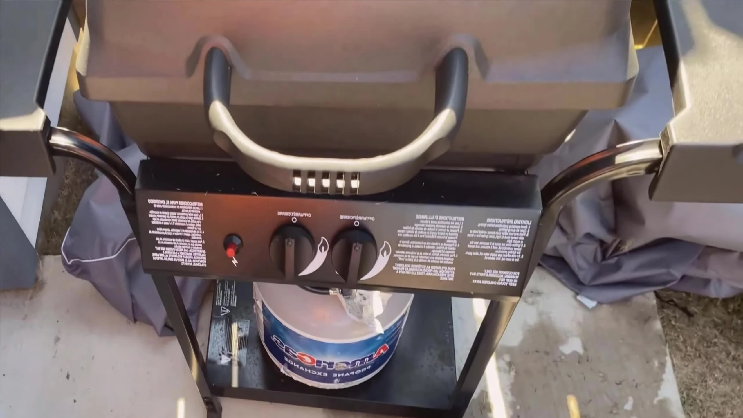 Shot of the grill's burner system, emphasizing the stainless steel construction and two burners.