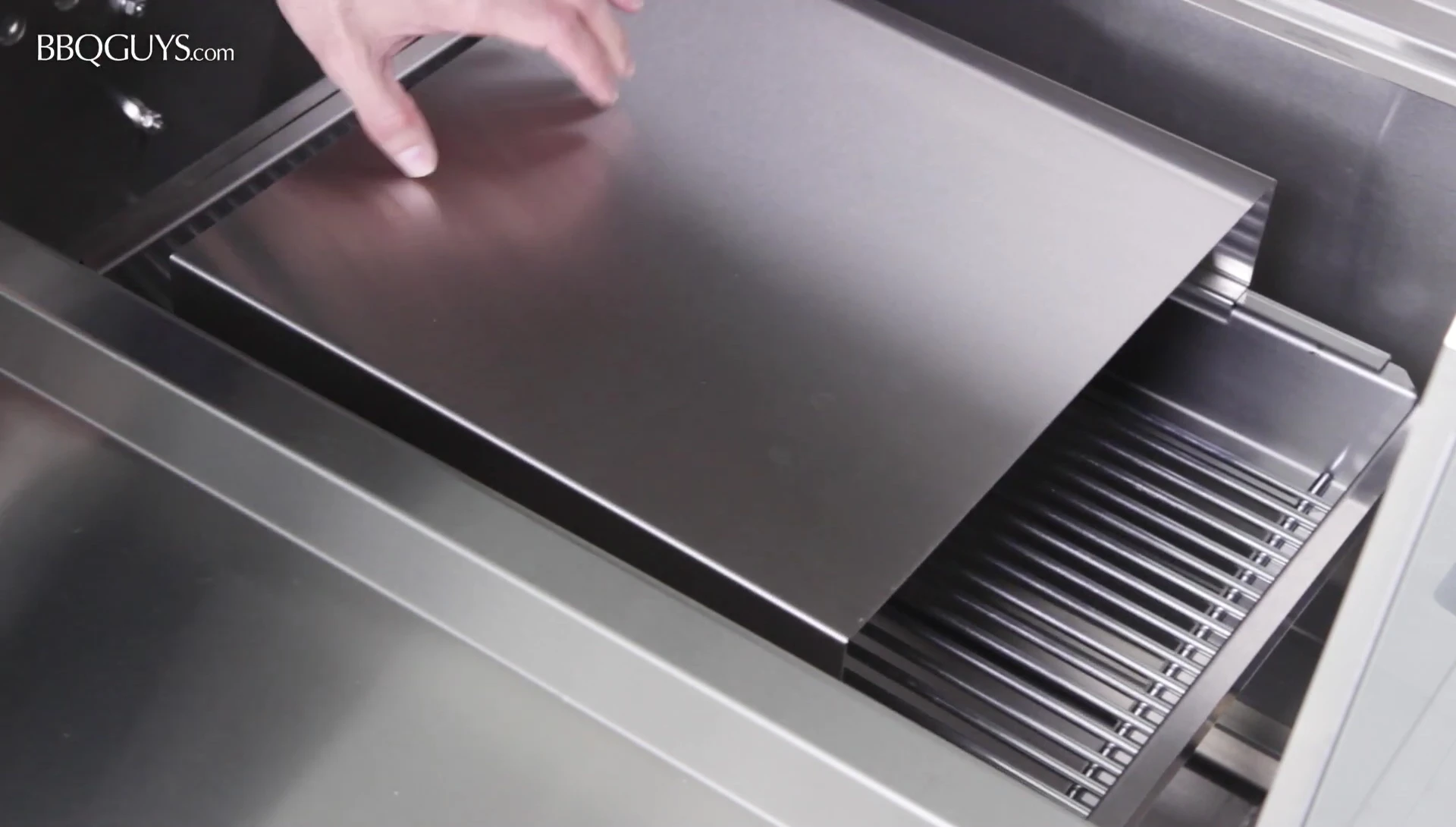 The removable stainless steel heat deflector.