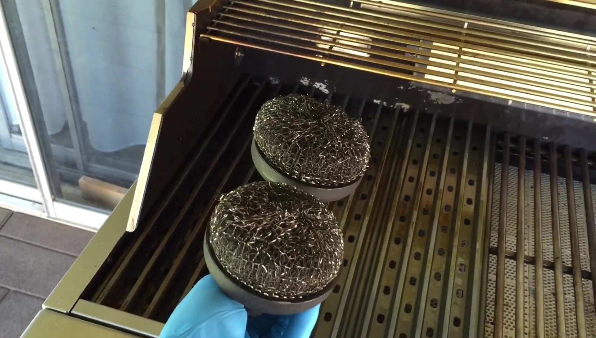 The Grill Grates cleaning tool.