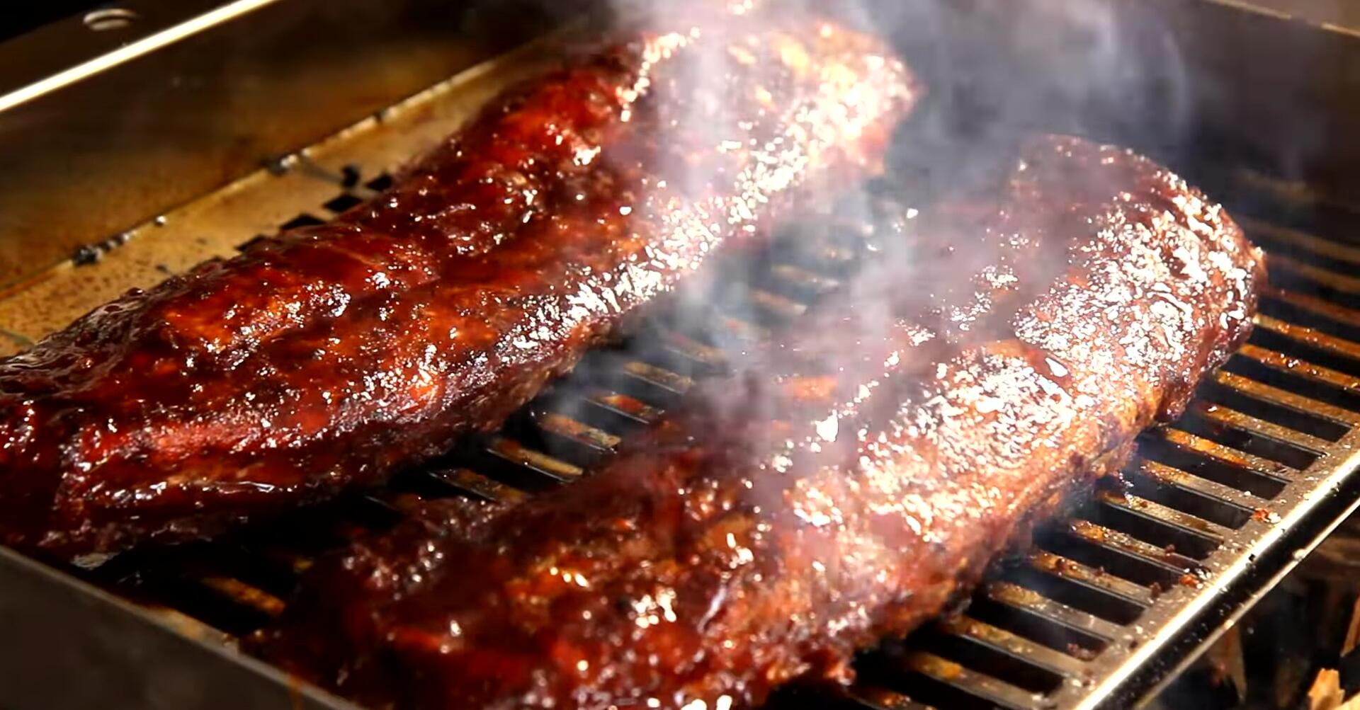 Highlighting the grill's capacity for low-and-slow cooking.