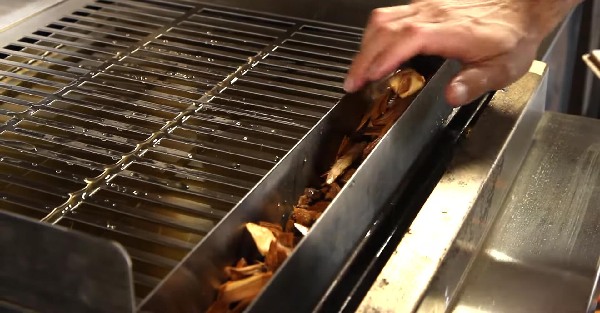 The stainless steel smoker roaster rack accessory.