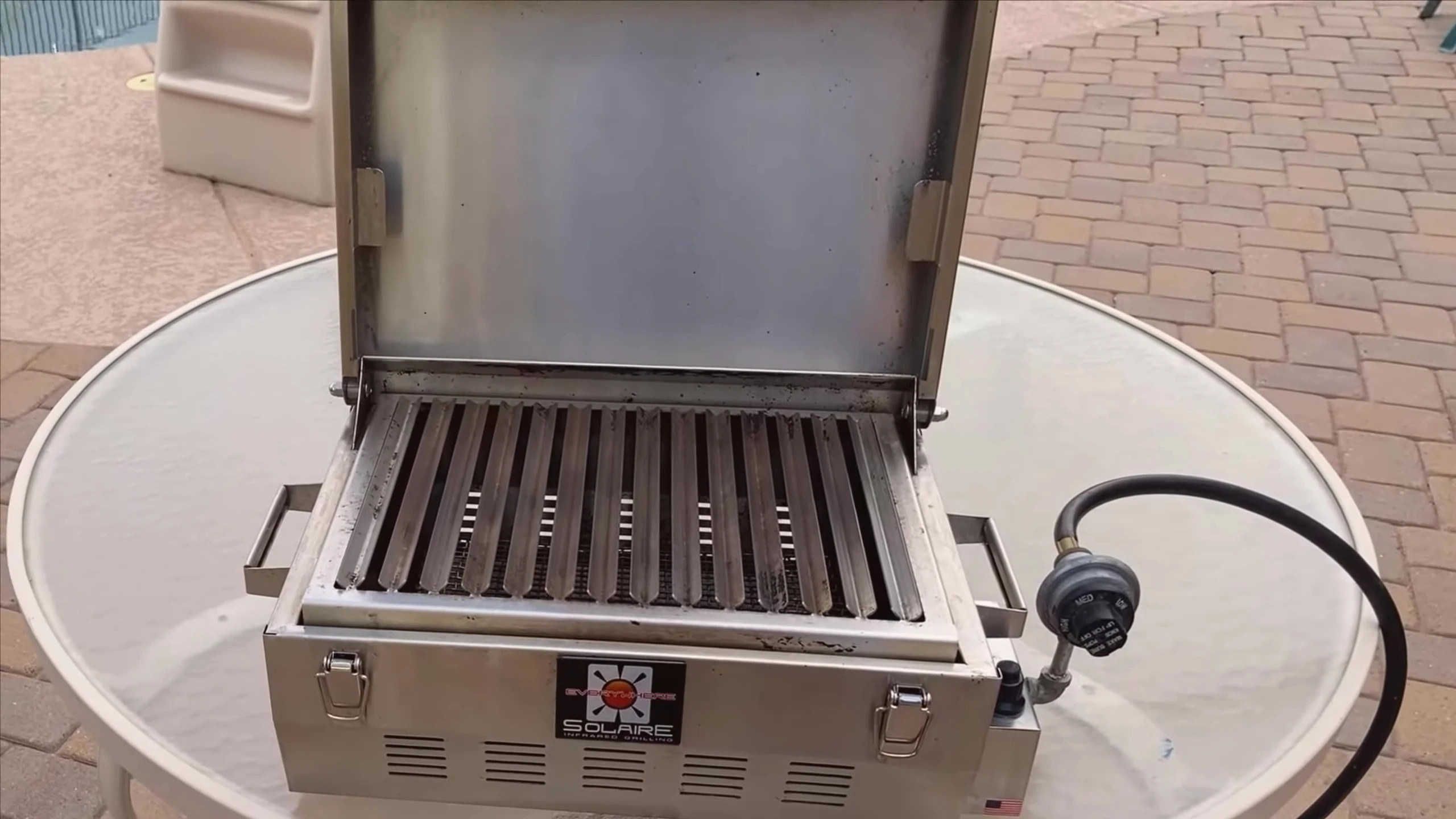Interior view of the grill, highlighting the stainless steel construction.