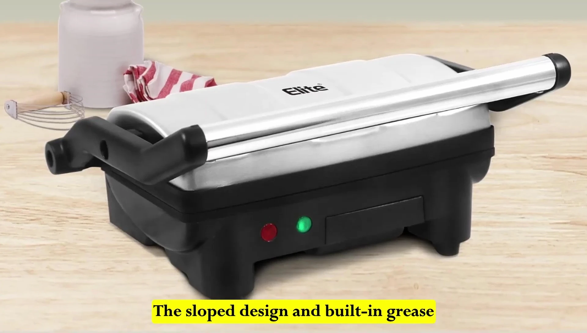 Highlighting the grease reservoir and slide-out drip tray.