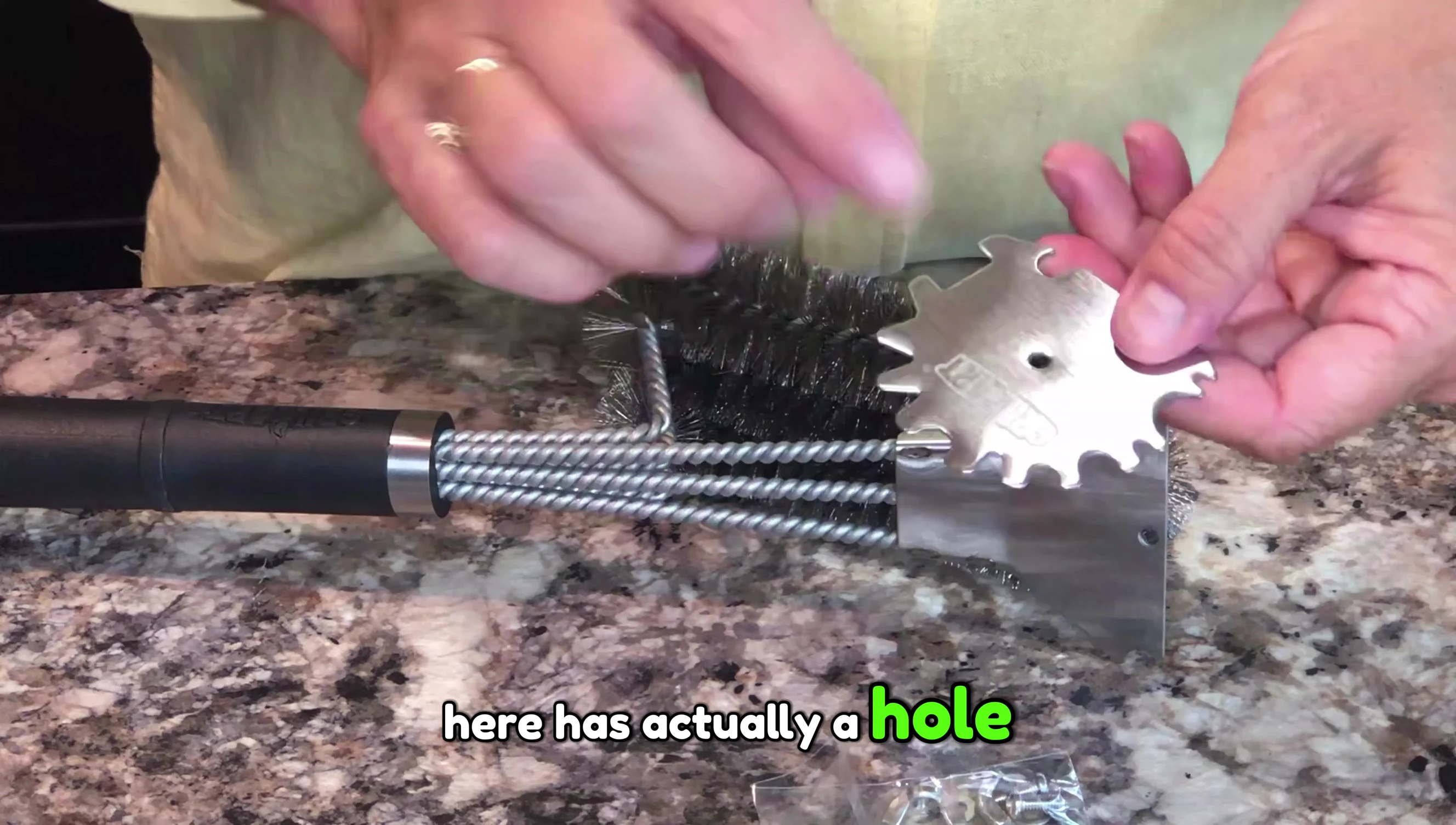 Demonstrating the different scraper attachments.