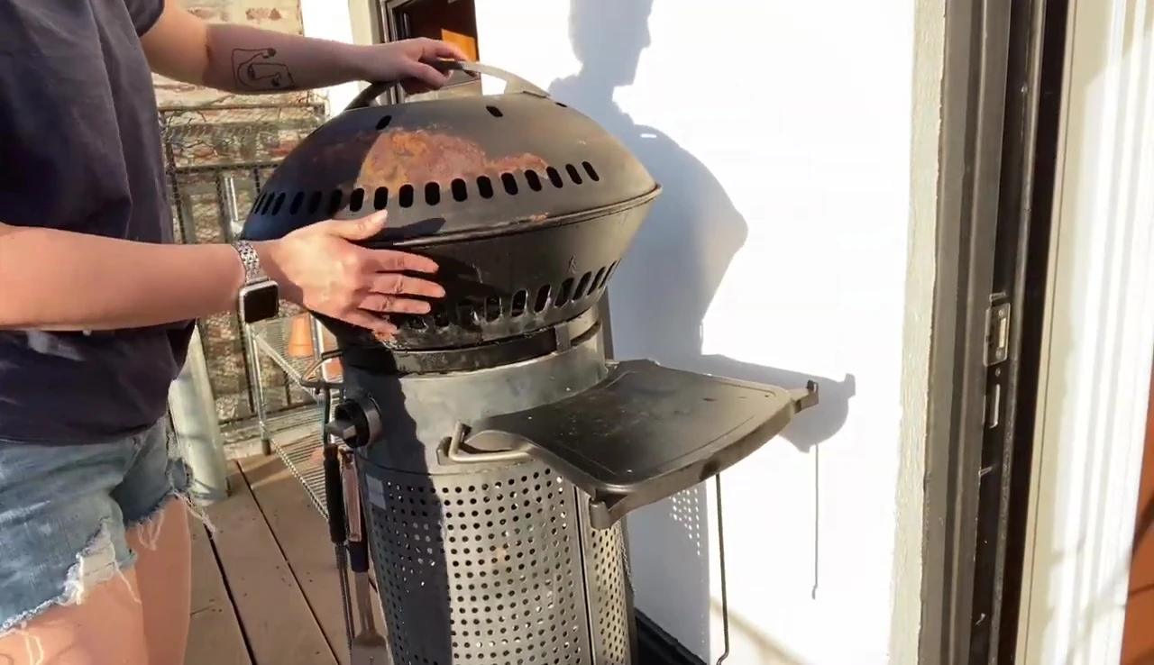 The Fuego grill situated on a balcony, highlighting its space-saving design.