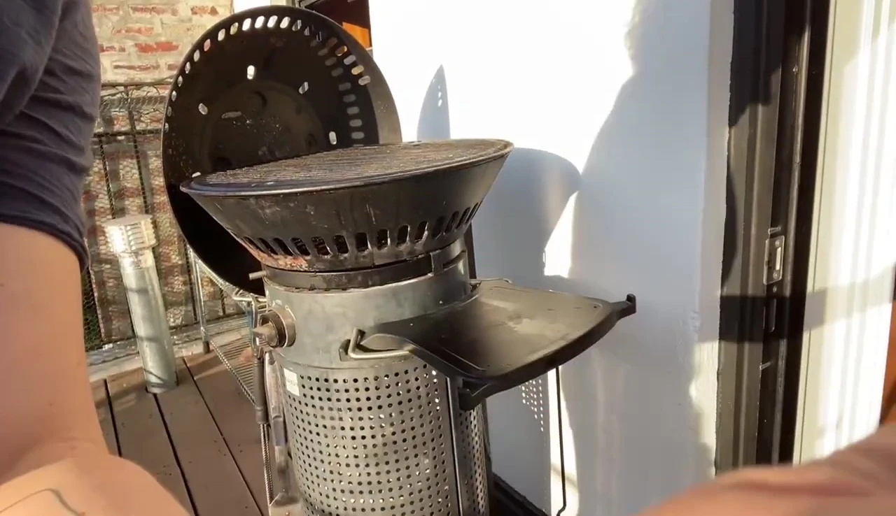 Person turning on the gas valve of the Fuego grill.