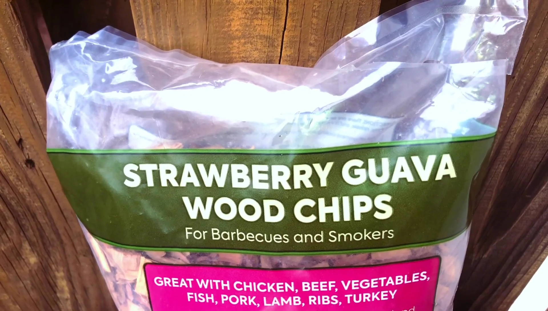 The reviewer holds the wood chips and inhales their scent.